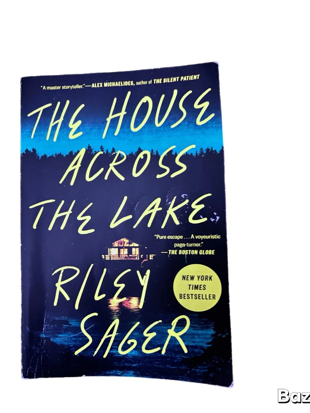 The House Across The Lake by Riley Sager - Navy Blue & Yellow Paperback